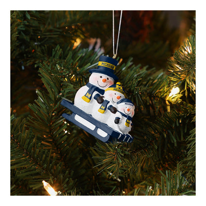 Michigan Wolverines Snowman Sledding Family Holiday Ornament - Front View Lifestyle